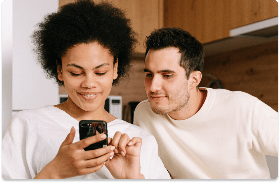 A couple reviewing their vehicle history report